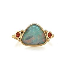 This Opal glows from deep within, from blue to green to pink, purple and orange. Set in 14k yellow gold with the most perfect orangesapphires. Accented with gold beads and Emily's seagrass band. Set in an opened back setting to allow maximum light play to pass through its flashy rainbow. Approx stone size: 12mm x 10mm Approx Ct weight: 1.9 cts Mohs Hardness 6 This piece is handmade to order in Emily's Hudson Valley studio. It is currently a size 7 but can be resized at no charge prior to shippin Yellow Gold Ethiopian Opal Multi-stone Jewelry, Ethiopian Opal Multi-stone Yellow Gold Jewelry, Multi-stone Ethiopian Opal Jewelry In Yellow Gold, Ethiopian Opal Multi-stone Jewelry In Yellow Gold, Orange Multi-stone Fine Jewelry Rings, Unique Ethiopian Opal Rings In Yellow Gold, Yellow Gold Ring With Ethiopian Opal And Birthstone, Yellow Gold Ethiopian Opal Birthstone Ring, Yellow Gold Ethiopian Opal Ring With Birthstone