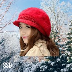 a woman wearing a red hat in the snow