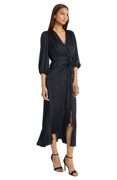 For slimming style and a flattering fit, this faux-wrap dress is an easy winner in the wardrobe game. 55 1/2" length Hidden back-zip closure V-neck Three-quarter sleeves Lined 97% polyester, 3% spandex Dry clean Imported Classic Slippers, Concert Looks, Illusion Dress, Wrap Midi Dress, Maggy London, Effortless Elegance, Sweaters And Leggings, Faux Wrap Dress, Comfortable Dress