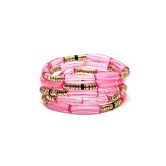 Features: *NEW CUSTOM DESIGN* 4mm translucent rosie pink curved acrylic beads 4mm 14k gold plated Indian discs 4mm Black rubber beads 7-inch elastic stretch band one size fits most Pink Beaded Bracelets With Gold Beads For Party, Pink Stackable Beaded Bracelets For Party, Party Pink Beaded Bracelets With Gold Beads, Pink Plastic Beaded Bracelets For Party, Trendy Pink Stretch Bracelet, Trendy Pink Plastic Stretch Bracelet, Pink Stackable Stretch Bracelet With Round Beads, Novelty Pink Bracelets With Round Beads, Pink Beaded Plastic Jewelry