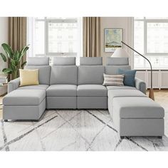 a living room with a large gray sectional couch