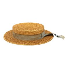 The Ridgemont Make's vintage 1930s boater hat showcases timeless elegance with its natural straw construction. Adorned with a pale blue ribbon and bow, this hat epitomizes classic style. The sturdy yet lightweight straw provides comfort and durability, while the charming ribbon adds a touch of sophistication. This boater hat captures the essence of vintage summer fashion, making it a coveted accessory for collectors and design enthusiasts alike. Seven are available for a display collection. Mode Vintage Adjustable Boater Hat With Flat Crown, Vintage Straw Boater Hat With Short Brim, Vintage Straw Boater Hat With Flat Brim, Vintage Natural Boater Hat With Short Brim, Vintage Straw Panama Hat For Kentucky Derby, Vintage Flat Crown Hats For Beach, Vintage Flat Crown Hats For The Beach, Vintage Hat Bands For Beach With Flat Crown, Vintage Brimmed Boater Hat In Toquilla Straw