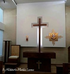 a church alter with a wooden cross on it