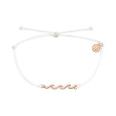 PRICES MAY VARY. DAINTY WAVE CHARM - Embellished with a rose gold-plated wave charm that accentuates the braided band, this accessory offers a minimalist yet elegant addition to your everyday outfit. WATERPROOF BRACELET - This Delicate Wave Bracelet from Pura Vida is 100% waterproof. Go conquer the waters without worrying about your accessory. This premium bracelet will not fade nor disintegrate even when in contact with water. ADJUSTABLE BRAIDED BAND - This bracelet comes with an adjustable ban Leather Anklets, Wave Bracelet, Rose Gold Charms, Gold Waves, Pura Vida Bracelets, Hang Ten, Bar Bracelets, Ankle Bracelets, Gold Charm