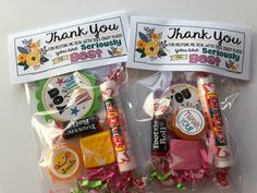 two bags of candy with thank you stickers on the front and back of them