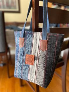 a handbag hanging from a wooden chair