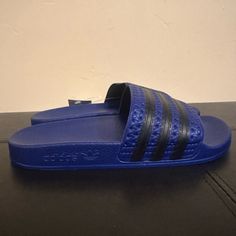 Adidas Adilette Boys Blue Slide Sandals Size 4 Sporty Blue Slides For Vacation, Comfortable Blue Slippers For Vacation, Blue Slip-on Summer Flip Flops, Adidas Slides For Swimming In Summer, Adidas Slides For Summer Swimming, Blue Non-slip Slides For Vacation, Non-slip Blue Slides For Vacation, Blue Sporty Flip Flops For Vacation, Non-slip Blue Flip Flops For Swimming