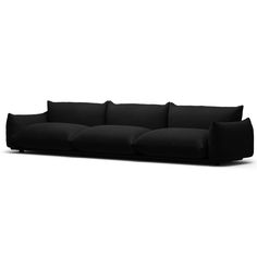 a black couch sitting on top of a white floor