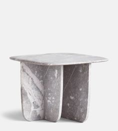 a white marble table with two curves on it