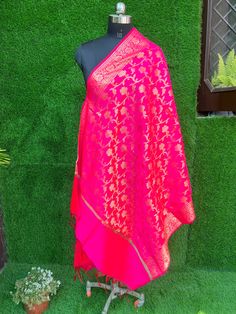 Product details:- Hot pink and Gold-toned ethnic motifs woven design Dupatta zari,tasselled border. Material:-silk Hand wash Banarasi Silk Dupatta With Latkans For Traditional Ceremonies, Elegant Pink Traditional Wear With Pallu, Elegant Pink Art Silk Traditional Wear, Elegant Pink Traditional Wear With Zari Weaving, Festive Pink Raw Silk Traditional Wear, Elegant Pink Banarasi Silk Saree, Elegant Pink Dupatta For Festive Occasions, Elegant Pink Dupatta For Diwali, Pink Traditional Wear For Transitional Season