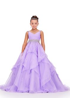 Elevate your little one's pageant look with the Ashley Lauren Kids 8219 Girls Layered Feather Pageant Dress. This stunning ballgown features a V-neck embellished with feathers, adding a touch of glamour to the overall design. With its layered skirt, this dress will make your child feel like a princess on stage. Be the star of the show in this fabulous organza ball gown. This dress features a v-neckline, beaded waistband and shoulder straps. The ruffled skirt has press-on stones and feathers comp Pageant Dresses For Kids, Toddler Pageant Dresses, Pagent Dresses, Organza Ball Gown, V Neck Gown, Kids Pageant Dresses, Kids Pageant, Ashley Lauren, Girls Pageant Dresses