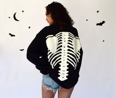 Stock is very limited this year, so get it before it's gone. Very high quality, super cool, oversized sweatshirt with 3D puff printed skeleton design on the arms, front, and back. Glow in the dark effect is very strong. You just need to expose it to sunlight for a few minutes.  Both the female and the male models are 5'8 and are wearing size Large. Exchanges are accepted on this item in case you would like a different size. 100% cotton. Oversized Sweatshirt For Halloween Streetwear, Halloween Streetwear Sweatshirt With Relaxed Fit, Oversized Long Sleeve Sweatshirt With Skull Print, Oversized Long-sleeve Sweatshirt With Skull Print, Oversized Spooky Halloween Sweatshirt, Spooky Oversized Halloween Sweatshirt, Oversized Halloween Sweatshirt For Loungewear, Oversized White Halloween Sweater, Dark Effect