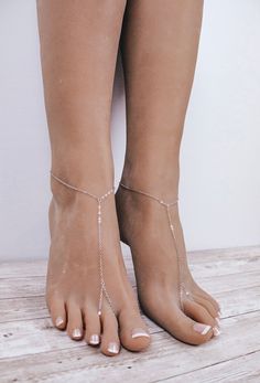 Stunning and simple pair of silver plated chained barefoot sandals. This pair of chained barefoot sandals was handcrafted using elegant and delicate silver plated chain and 2mm jump rings. The sandals close with a comfortable lobster clasp and provide comfortable fit due to extra 2 inches of adjustable closure in the back. Wear them with flip flops, with heels or completely barefoot. Sold as a pair, gift wrapped. Shipped within 2 business days of purchase. All rights reserved @ Bare Sandals. Cop Adjustable Chain Anklet For Summer Parties, Summer Beach Anklet With Adjustable Chain, Silver Minimalist Anklets For Party, Dainty Summer Party Anklets, Silver Barefoot Sandals For Summer Gift, Elegant Silver Anklets For The Beach, Dainty Adjustable Chain Anklets For Summer, Delicate Silver Anklets For Summer, Summer Dainty Anklet With Adjustable Chain