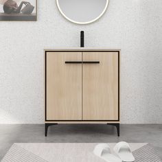 a bathroom vanity with a round mirror above it