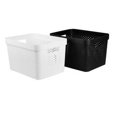 two black and white storage baskets sitting side by side, one with holes on it