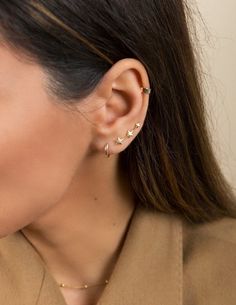 "These delicate star ear climbers gently follow the curve of your earlobe. Minimal enough for everyday and will beautifully complement any outfit, on any occasion. ∙ Sold as a pair * D E T A I L S * ∙ Material: .925 Sterling Silver or 18K Gold Plated over .925 Sterling Silver ∙ Dimensions: 18mm ∙ Fit: Our ear climbers are easy to wear and designed to stay in place - simply slide through a pierced hole like normal earrings and turn so the ear wire hugs the back of your ear. To adjust for a perfec Zodiac Earrings, Gold Ear Climbers, Gold Star Earrings, Star Constellation, Starburst Earrings, Star Constellations, Ear Climbers, Earrings Dainty, Earrings Minimalist