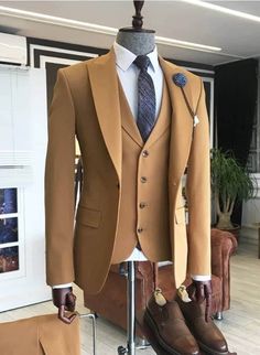 Are you planning a wedding or other social event that you want to look good and stand out in the crowd? Then this suit is a must have.  It is carefully made and finished with the best of fabric.  It comes in brown color but can be customized in any color of your choice.  Product Details: 1. Brown 3 piece single breasted suit (jacket/coat, vest/waistcoat & pants). 2. Sewed with a blend of cotton and wool fabric of high quality. Best fabric for suits. 3. Comes in sizes XS to 3XL. For larger sizes, Brown Grooms Suit, Wedding Suit Brown, Brown Mens Suit, Brown Groomsmen Suits, Brown Wedding Suit, Brown Groomsmen, Grooms Suit, Single Breasted Suit, Mens Wedding Suits