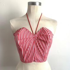 Cute Candy Stripe Bustier!  Handmade circa 1980's in the style of a 1950's Suntop. *100% Sturdy Cotton * Tailored Fit (No Stretch)    * Nylon Zip Back Closure  * Extreme Structured Bustline with neck tie detail   * Extreme Boned Bust (flexy plastic boning) * Red & White Colourway in Candy Stripe Pattern Quiet Cruedly Handmade but still very wearable! was perhaps a costume piece originally. Best fit Bust - 34" inches Max (slim back but larger bust is the fit it is designed for) Best fit Waist - 2 Fitted Cotton Halter Top With Built-in Bra, Summer Halter Neck Fitted Corset, Vintage Summer Top With Built-in Bra, Fitted Bandeau Halter Top For Spring, Summer Cropped Top With Boned Bodice, Retro Fitted Tank Top For Spring, Red Summer Corset With Built-in Bra, Summer Vintage Top With Built-in Bra, Red Fitted Cropped Halter Top