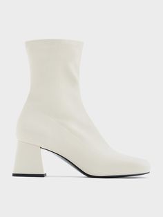 This pair of sophisticated ankle boots have all the features we love about the classic fall shoe style - covered round toes, subtle stitch-trim details, and a side-zip design that makes them easy to put on and take off. Complete in an elegant, all-white hue and metallic gold trapeze block heels, the small but striking details imbue them with a subtly luxurious flair that will put the perfect finishing touch on any ensemble. Wardrobe Elevation, Fall Fashion Shoes, Fall Shoe, Boots Chunky, Zip Design, Heel Ankle Boots, Charles Keith, Fall Shoes, Trim Detail