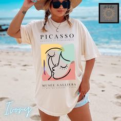 Modern abstract art Picasso tee. This is the vintage style Comfort Colors shirt with a trendy design that women adore. When ordering, please refer to size chart.  Please refer to size chart for best fit and order up 1-2 sizes for an oversized look. NO RETURNS OR EXCHANGES Gildan is back with its garment-dyed t-shirt, a fully customizable tee made 100% with ring-spun cotton. The soft-washed, garment-dyed fabric brings extra coziness to your wardrobe while the relaxed fit makes it an excellent dai Oversized Multicolor T-shirt For Summer, Summer Shirt With Graphic Design And Relaxed Fit, Artsy Printed Summer Tops, Artsy Printed Tops For Summer, Artistic Crew Neck Shirt For Summer, Relaxed Fit Fashion Print T-shirt With Short Sleeves, Fashion Print Relaxed Fit T-shirt With Short Sleeves, Fashion Print Relaxed Fit Short Sleeve T-shirt, Retro Graphic Design Shirt For Summer