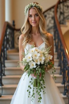 a woman in a wedding dress holding a bouquet of flowers