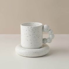 a cup and saucer sitting on top of each other