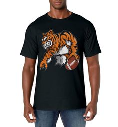 PRICES MAY VARY. Tiger Football T-Shirt High School College Fan Player Parent Gift. Love local high school and college football? Perfect if your school mascot is a tiger. Cheer for your team in this cool tee. Great game day wear. Fun fan tee for football players, football dads and moms, football fathers, football youth, football boys, football parents and grandparents too. Fun novelty tee perfect for every day wear and a great gift idea. See brand above for more football shirts. Lightweight, Cla Team-colored Mascot T-shirt For Sports Events, Sports Season Mascot T-shirt For Fans, Team Spirit Mascot T-shirt For Sports Events, Team Spirit T-shirt With Mascot For Sports Events, Mascot T-shirt For Sports Season Fan Merchandise, Collegiate Mascot T-shirt For Fans, Collegiate Mascot T-shirt For Fan Gear, Collegiate T-shirt With Mascot For Fan Gear, Team-colored Short Sleeve T-shirt With Mascot