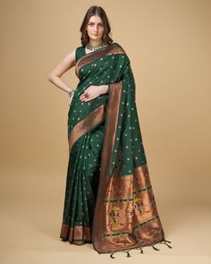 ❤Dark Green Paithani Silk Saree❤ ❤Enhance your elegance with silk sarees❤ FABRIC:- ❤Pure Paithani dark green silk saree with rich weaved❤Pallu with tassels & unique pattern & also full anmol zari jal pattern❤ Blouse : Plain with zari border ❤️Why You'll Love It: *Adds a touch of luxury and tradition to your wardrobe. *Unique, one-of-a-kind piece that makes a statement. *High-quality silk ensures a smooth and lustrous finish. 🛍️How to Order: 1.Select your preferred saree and add it to your cart. 2.Complete the purchase through our secure payment gateway. 3.Receive your saree with free worldwide shipping. 📞Contact Us: For any inquiries or requests, feel free to reach out: Email: rajashwifashionhub@gmail.com WhatsApp On: +91-9624471515 Message Us: Through Etsy's messaging system Visit Our S Green Embroidered Paithani Silk Traditional Wear, Bottle Green Paithani Saree, Jal Pattern, Elegant Green Paithani Silk Dupatta, Luxury Green Paithani Silk Dupatta, Green Paithani Saree, Green Paithani Silk Saree With Border, Dark Green Silk Saree, Green Silk Saree