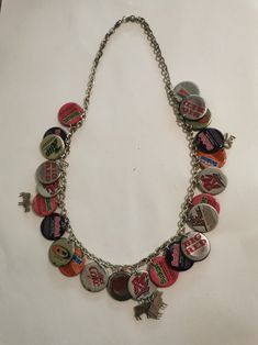 Very unusual bottle top necklace. Approx 72 cm long in total. Metal chain.  23 x bottle tops used to make this necklace with the addition of 4 x cow motifs. The rear of most bottle tops has been lined with a cow motif.... Thrifted Necklaces, Cow Pics, Thrift Manifest, Grunge Necklace, 7 Up, Rc Cola, Cow Pictures, Bottle Top, Vintage Bottle