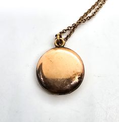 Gold filled etched locket mid century photo necklace. Good used condition with little to no signs of normal wear. Chain has early thumb clasp. Etched with the number 16 on the inside of each side of locket. Comes with vintage picture and frame. Necklace measures 15.5 inches long. Locket measures 5/8ths of an inch across. Brass Locket Necklace For Keepsake, Brass Medallion Locket Necklace, Vintage Charm Medallion Necklace In Brass, Vintage Medallion Locket Necklace As Gift, Cameo Medallion Locket Necklace Keepsake, Cameo Medallion Locket Necklace For Keepsake, Brass Medallion Locket Necklace With Cameo, Vintage Cameo Pendant Locket Necklace, Vintage Coin Pendant Necklace For Wedding