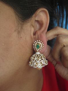 Mesmerizing 18 Karat Gold '4 in 1' Detachable Diamond Jhumkas - Diamond Dangle Earrings with Color Stones & Pearls
  Note: Only front side has Diamonds as shown in the picture, the back part of the Jhumka which is not visible from the front is only Gold without Diamonds 
  This product has Inter Changeable Red & Green color Stones in the Earrings 
    1. You can wear the earrings (ear tops) by itself 
  2. You can wear the ear tops with the middle layer only 
  3. You can wear the ear to Gold Diamond Danglers For Wedding, Gold Earrings With Intricate American Diamond Design, Gold Fusion Jhumkas For Formal Occasions, Gold Fusion Style Jhumkas For Formal Occasions, Gold Fusion Style Jhumkas For Formal Events, Gold American Diamond Earrings For Reception, Gold Diamond Jhumkas In Temple Jewelry Style, Gold Diamond Temple Jewelry Jhumkas, Traditional Gold Diamond Jhumkas