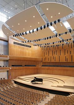 an empty concert hall with rows of seats