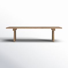 a wooden bench sitting on top of a white floor