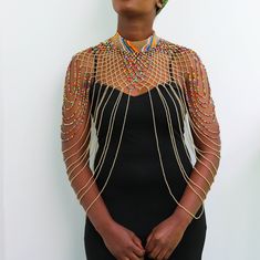 African beaded shawl necklaces, Beaded cape necklaces, Beaded wedding necklace, Beaded choker necklace, Statement necklace, Christmas gift A 100% handmade in Kenya necklace. Can fit any body type as it layers well with the body *Color: Beige and multicolor *Necklace height:  25 inch/63 cm *Neck size length : 13.5 inch / 34 cm (Adjustable and extends up to 16 inch/ 41cm 3-5 days delivery via shipping via DHL Express  Shipping fee is for the first item only and additional items ship for free. To continue shopping for similar necklaces, kindly click here: https://www.etsy.com/shop/NkoroiCrafts?ref=simple-shop-header-name&listing_id=1424741895&section_id=40416611 Thank you for visiting! Elegant Colorful Beads Choker For Parties, Bridal Necklace With Beaded Chain For Party, Bridal Necklace With Round Beads For Party, Bridal Necklace With Round Beaded Chain For Party, Traditional Bib Necklace With Colorful Beads For Parties, Elegant Party Choker With Colorful Beads, Traditional Beaded Bib Necklace For Party, Elegant Festival Bib Necklace With Colorful Beads, Party Beaded Choker Necklace