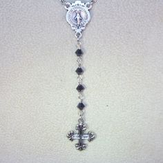 "Inspired by Yolanda Foster Rosary on The Real Housewives of Beverly Hills - shown in Black crystal and silver. This listing is for a custom made rosary necklace 20\" long (excluding the drop) made with Swarovski 4mm pearls or crystals in your choice of color. You will have your choice or gold or silver findings including the cross and center connector. Each rosary is 4 decades plus the drop and has a lobster clasp and a 3\" extension. Can also be made as an Anglican or Jewish rosary. Convo me f Silver Necklace With Miraculous Medal For Jewelry Making, Commemorative Silver Jewelry With Miraculous Medal, Silver Cross Jewelry With Miraculous Medal, Adjustable Silver Necklace For Memorial, Crystal Crucifix Jewelry As Gift, Adjustable Silver Spiritual Jewelry And Charms, Personalized Silver Crucifix Jewelry, Silver Jewelry With Miraculous Medal For Gift, Silver Necklace With Miraculous Medal For Wedding