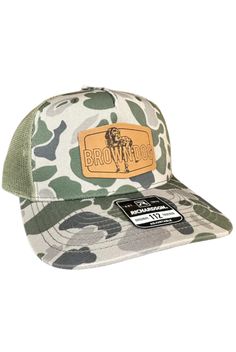 RICHARDSON 112 Trucker Hats in DUCK CAMO! Classic trucker cap style built with the Richardson quality and fit you’ve come to expect with a traditional Brown Dog leather patch. ​​​SHAPE: MidProFABRIC: Cotton-Poly/Nylon MeshVISOR: PrecurvedSWEATBAND: CottonFIT & SIZE: Adjustable Snapback, One Size Fits Most Camo Hat, Camo Hats, Cap Style, Brown Dog, Leather Patches, Trucker Hats, Trucker Cap, Hats For Men, Hosiery