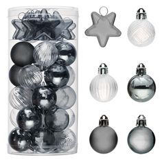 an assortment of christmas ornaments in a clear container with silver and black baubles