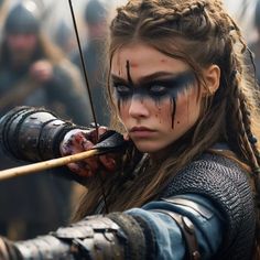 Viking Women Aesthetic, Vikings Aesthetic Woman, Viking Bow And Arrow, Circle Of Spores Druid Female, Viking Eye Makeup, Fantasy Warrior Aesthetic, Viking Warrior Woman Costumes, Viking Warrior Woman Art, Viking Face Paint Women