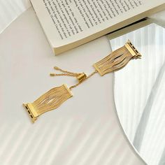 This band features a unique tassel chain design that adds a sophisticated and feminine touch to your wrist. Crafted from high-quality stainless steel, it offers durability and elegance, making it a perfect choice for any occasion. Features: Compatibility: This women's Apple Watch band is compatible with Apple Watch Series 7 / 8 / 9 (45mm), Apple Watch Ultra (49mm), SE / SE (2nd Gen), Series 6 / 5 / 4 (44mm), and Series 3 / 2 / 1 (42mm). Please check the back of your watch to ensure you order the correct size. Tassel Chain Design: The soft stainless steel tassel design on this Apple Watch chain band provides an extra level of sophistication and style, making you stand out from the crowd. Its slim and elegant design adds a chic and feminine look to your iWatch, while the carefully crafted co