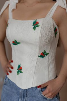 This exquisite corset is made of delicate chantallier lace ivory color, which gives it a special elegance. The base of the product is made of satin, which is covered with fine lace that fits perfectly on the body, with inserted cotton cups and plastic bones. Embroidery on the corset adds uniqueness and originality to the product. Embroidered motifs are placed throughout the corset, creating a harmonious and refined image. The corset has convenient lacing on the back that allows you to adjust the fit and provides comfortable wearing.  This original model is ideal for special occasions when you want to feel charming and confident. You can order an individual tailoring of this corset according to your measurements for the celebration of the wedding.  Individual tailoring is possible. To choos Elegant White Lace Bodice, Wedding Corset With Delicate Lace, White Lace Wedding Corset, Elegant Wedding Corset With Delicate Lace, White Lace Bodice With Sweetheart Neckline, White Wedding Corset With Delicate Lace, Fitted Embroidered Cream Lace, White Delicate Lace Wedding Corset, Fitted Cream Embroidered Lace