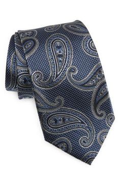 Paisleys swirl in subtle colors on a tie crafted for versatility and distinction from textured silk. 3 1/2" width; 62 1/2" length 100% silk Dry clean Imported Elegant Business Suit And Tie Accessories With Paisley Print, Elegant Patterned Ties For Formal Occasions, Elegant Paisley Print Neckwear For Business, Elegant Formal Patterned Ties, Elegant Patterned Neckwear For Formal Occasions, Elegant Formal Patterned Neckwear, Elegant Semi-formal Ties With Paisley Print, Elegant Patterned Standard Tie, Elegant Semi-formal Neckwear With Paisley Print