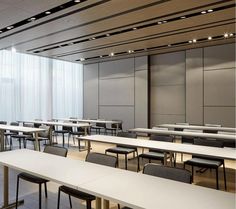 an empty classroom with desks and chairs