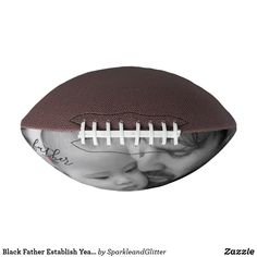 an image of a baby kissing on top of a football with the words black father's day written on it