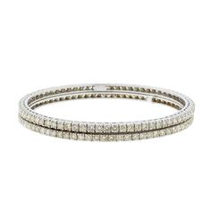 PRODUCT DETAILS Gold Purity(karat): 18k Item Weight(grams): 27.2 Item Finish: White Gold Stone: Diamond Diamond Weight(carats): 10.99 ct Diamond Color: F-G Diamond Quality: VS Number of Bangles: 2 Bangle Size: 2.6 Openable: No td {border: 1px solid #ccc;}br {mso-data-placement:same-cell;} td {border: 1px solid #ccc;}br {mso-data-placement:same-cell;} td {border: 1px solid #ccc;}br {mso-data-placement:same-cell;} td {border: 1px solid #ccc;}br {mso-data-placement:same-cell;} td {border: 1px solid White Bangle With Single Cut Diamonds, Fine Jewelry White Bangle With Single Cut Diamonds, Classic Diamond White Bangle Hand Set, Classic Hand Set Diamond White Bangle, Formal White Bangle With Single Cut Diamonds, Dazzling Anniversary Bangle With Single Cut Diamonds, Dazzling Bangle With Single Cut Diamonds For Anniversary, Diamond White Diamond Bangle Bracelet, Dazzling Single Cut Diamonds Bangle For Anniversary