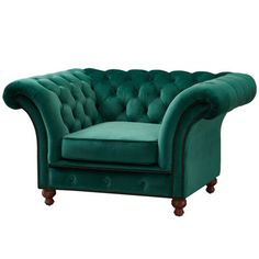 a green velvet chesterfield style chair with wooden legs and nail polishing on the armrests