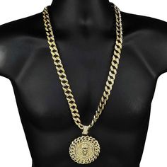 Jesus medallion pendant chain necklace. Cuban chain is 30" inch x 15 mm wide. Every chain link is encrusted with stones. Medallion Jesus pendant is 2.5" diameter. Stunning pendant has a cuban link design. Pendant necklace weighs 195 grams. Gold finish over high quality base metal. Stylish and secure box clasp closure. A truly incredible Jesus chain masterpiece. 100% FREE SHIPPING in US. Order now! Metal Medallion Necklace With Gold Chain, Metal Medallion Chain Jewelry, Metal Medallion Jewelry With Chain, Medallion Necklace With Gold Chain, Metal Pendant Chain Necklace With Curb Chain, Metal Jewelry With Round Rope Chain, Metal Jewelry With Rope Chain And Round Shape, Round Metal Jewelry With Rope Chain, Metal Medallion Necklace With Adjustable Chain