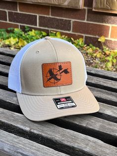 These leather patch Richardson 112 hats are a great way to flaunt your style and look sleek at the same time. Patches made from 100% leather and engraved with a crisp design and hand stitched on our most popular style of hat. Your friends are going to be jealous! Multiple hat colors available Hat colors available -Heather Gray/Black Mesh -Heather Gray/White Mesh -Black/White mesh -Black/Charcoal Mesh -Black/Gold Mesh & MANY MORE If a hat color is not listed please message us and we can order in Western Trucker Hat With Leather Patch, Western Style Adjustable Trucker Hat With Leather Patch, Western Trucker Hat With Leather Patch For Outdoor, Brown Hunting Hat With Leather Patch, Brown Leather Patch Hunting Hat, Outdoor Trucker Hat With Leather Patch And Short Brim, Western Hats With Leather Patch For Outdoor, Western Outdoor Hat With Leather Patch, Western Style Outdoor Snapback Hat With Short Brim