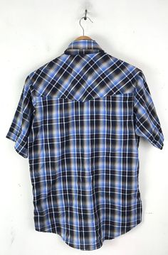 "-Description- >men's blue, black, red, white plaid short sleeve western shirt >collared >snap button front >two snap close pockets on the front >size small/ medium - tag is marked a small but chest measurement is more like a medium, please check all measurements before purchasing >awesome for a cowboy! >condition: great >color(s): blue, black, white, red >fabric(s): 65 polyester / 35 cotton >brand: plains >care: machine wash -Measurements- >size: small/medium Plaid Short Sleeve Camp Shirt With Relaxed Fit, Short Sleeve Plaid Flannel Shirt With Pockets, Plaid Short Sleeve Flannel Shirt With Pockets, Casual Plaid Short Sleeve Camp Shirt, Western Style Short Sleeve Relaxed Shirt, Western Style Relaxed Fit Short Sleeve Shirt, Relaxed Fit Short Sleeve Western Shirt, Plaid Short Sleeve Shirt With Relaxed Fit, Western Style Collared Cotton Shirt