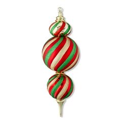 three red and green striped ornaments hanging from a gold hook on a white wall in the shape of christmas balls