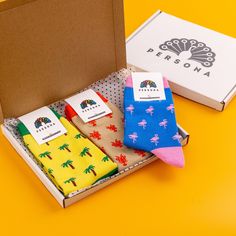 "Looking for a fun and colourful set of socks to add some fun to your sock drawer or as a great unique and luxurious gift for him? Then look no further because our \"Terrifically Tropical\" socks are perfect for just that! Bold colours, deliciously good designs and ultimate comfort - what more do you need?!  All of our socks are made from Egyptian cotton, which is extremely soft and luxurious - so soft it feels like you are walking on a cloud! Egyptian cotton socks have longer fibres than regular cotton socks, meaning that they are softer, more durable and kinder to your skin than regular cotton socks. The longer fibres also mean that our socks do not soak up moisture, so they will leave your feet feeling cool - seriously, what's not to love about these luxury socks?! We design all of our Novelty Multicolor Socks As A Gift, Sock Gift, Luxury Socks, Motif Tropical, Funky Socks, Sock Drawer, Flamingo Pattern, Sock Game, Cozy Socks